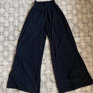 Black wide leg yoga pants with slit on both side. Size Medium